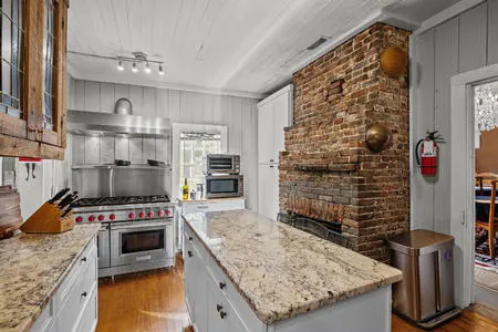 Updated Chef's Kitchen includes a walk in pantry for storage