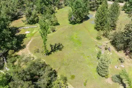 This gorgeous 6.85 acre property is situated between two entrances to Yosemite