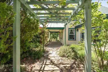 The main entrance to the home that features 3 bedrooms and one bath