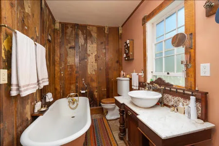 The bathroom was intentionally made to look rustic to fit with the home