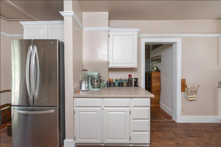 This opens to the utility room, pantry and a spacious storage area