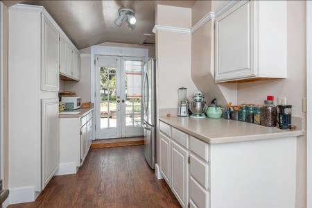 The French doors lead to the patio where some guests may want to dine