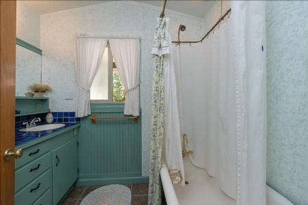 The bathroom offers the option of a shower or a lovely soak in the tub