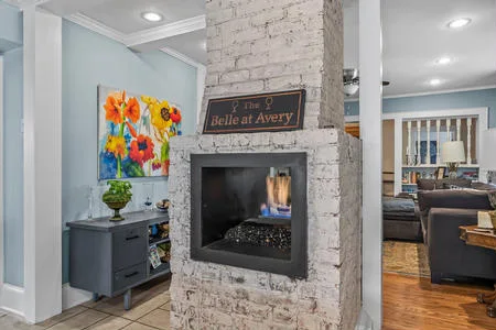 Gas log double sided fireplace in owner kitchen/living room space