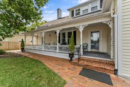 Owners rear covered porch & entry